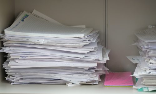 Documents and papers in a pile, documents in an office